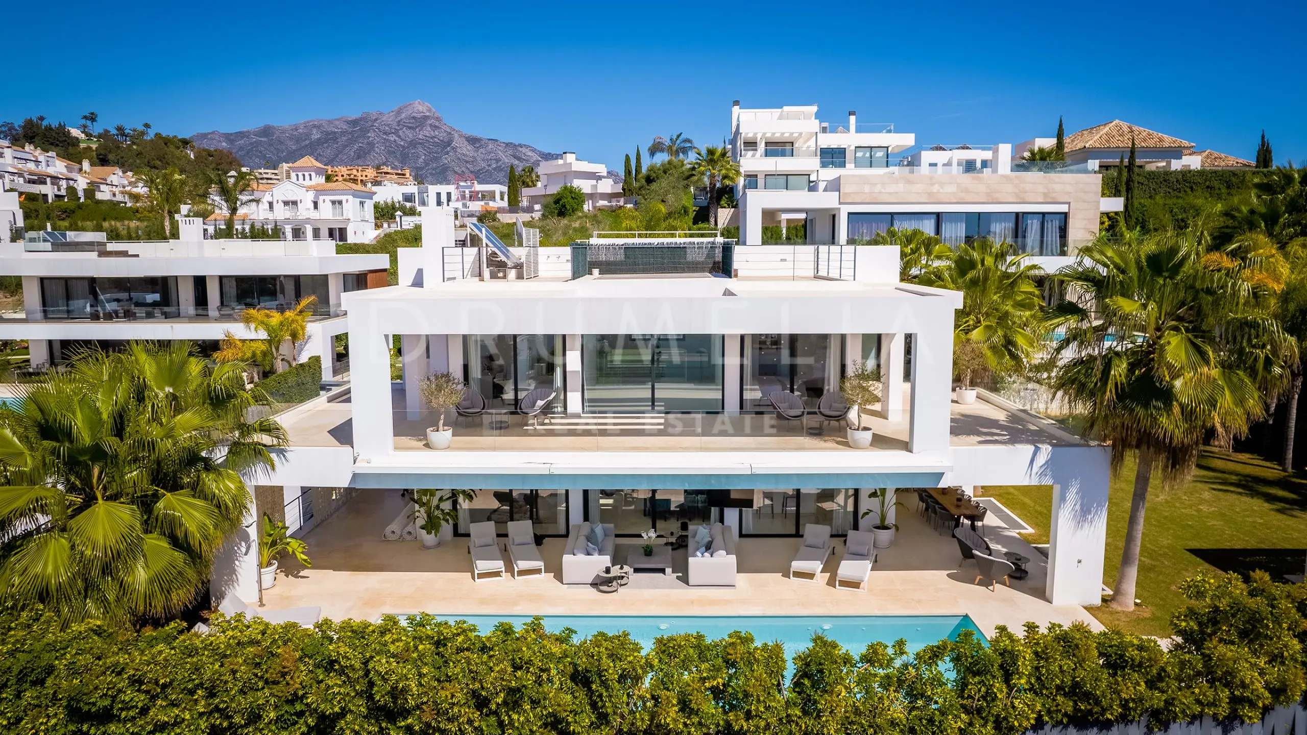 Modern luxury villa exterior with private swimming pool in Marbella